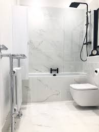 Available in bianco carrara, crema d'orcia, pietra d'avola and silk georgette dimensions. White Marble Bathroom With Black Taps Novocom Top