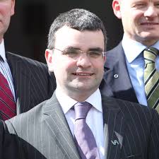 Fianna Fail chiefs wrestling with the party's debts are gearing up for a  row with grassroots members who want to abolish the traditional church gate  collection