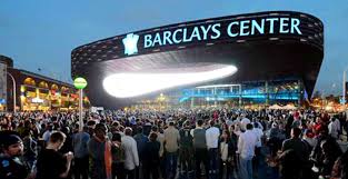 No,he does not owe the new york knicks but he owes part of the brooklyn nets that is why instead of the new jersey nets it is now the brooklyn. Barclays Center Downtown Brooklyn