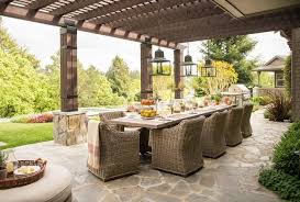The cheapest offer starts at £10. Under A Pergola Iron And Glass Lanterns Hang Over A Long Dining Table Surrounded By Wicker Dining Chairs Pergola Outdoor Pergola Pergola Patio