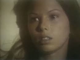 With tears in her eyes, Tiare Auber (Karen Mani) listens to Carrie DeWitt  try to explain his flight.