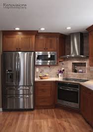 Kitchen Remodel By Renovisions Induction Cooktop Stainless Steel Appliances Cherry Cabinets Shaker Cabin With Images Kitchen Layout New Kitchen Cabinets Kitchen Design