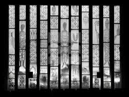 Detail of an etched glass window by Frank Roper, in the church's south-west  wall (DP347685) Archive Item