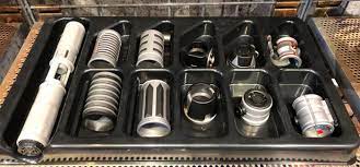 Galaxy's edge, you can build a lightsaber of your very own out of scrap metal over at savi's workshop. Star Wars Galaxys Edge Custom Lightsabers And Den Of Antiquities Revealed Film