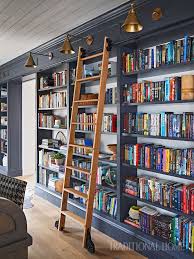A Wall Of Built In Bookshelves Is A Bookworm S Delight A Custom Sliding Ladder Enhances The Library Look In 2020 Home Library Design Home Libraries New York Apartment