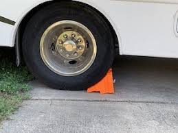 Homemade wheel chocks constructed from plywood, nuts, bolts, and washers. Do I Need Wheel Chocks For An Rv Or Travel Trailer Rvblogger