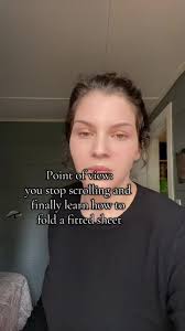 Watch A Guy Fold A Fitted Sheet