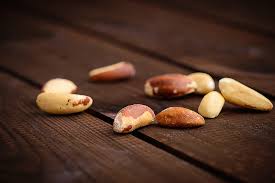 Handful of Brazil nuts on a wooden surface