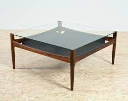 The leather is clean and cool and expertly tanned, the shape offers symmetry to the space, and the option of coffee table or foot rest makes this the best coffee table concept in a while. Rosewood Leather Glass Coffee Table By Kristian Vedel 1960s 94113