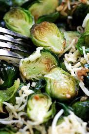Roasted Brussels Sprouts With Garlic And Parmesan Cheese This Oven Roasted Side Dish Is Full Of Fl Roasted Brussel Sprouts Brussel Sprouts Roasted Side Dishes