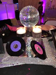 Disco was king, jaws menaced moviegoers, and everybody was on roller skates. Disco Themed Centerpiece Disco Party Decorations 70s Party Theme Disco Theme Parties