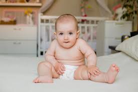 By haircut inspiration march 1, 2021. Premium Photo Cute Toddler Girl Smiles In Diapers Sitting On Bed At Home