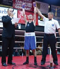 McKenzie wins bout in second round