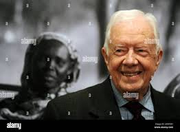 Former President Jimmy Carter and various Japanese guests take part in the  official opening of the Japanese Gardens at the Carter Presidential Center  in Atlanta, Oct. 1, 1986. (AP Photo/Ric Feld Stock