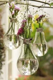 11 Unique Ideas For Decorating With Flowers Diy Light Bulb Light Bulb Vase Diy Lighting