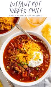 Add a cup of chicken broth to the instant pot, as well as a halved head of garlic and some fresh herbs. Instant Pot Turkey Chili 40 Aprons