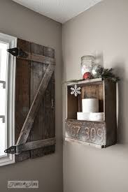 The stark white window frames paired with the black shutter tiebacks on the rustic outdoor shutters really knock this look out of the park. Barnwood Window Shutter