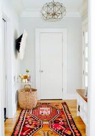 11 Decor Ideas To Make Narrow Hallways Look Bigger Hunker Entrance Hall Decor Hall Decor Small Entrance Halls