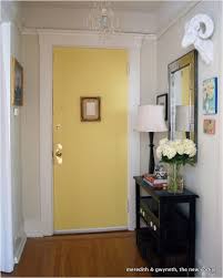 In this foyer, a blue geometric rug stretches from wall to wall, delivering a big dose of personality right inside the front door. Hugedomains Com Small Apartment Entryway Apartment Front Doors Small Apartment Decorating
