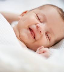 At 6 months old, babies will rock back and forth on hands and knees. Why Do Babies Smile In Their Sleep