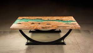 Two highly figured slabs of pacific burled maple shape a stream while a tropical colored resin inlay provides a flat, easy to clean surface to dine on. Tropical Blue Water Resin Coffee Table Live Edge Table Custom Furniture San Diego