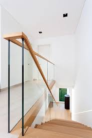 Interior Glass Railing Softened With Wood Handrail In 2020 Interior Stair Railing Stair Railing Design Staircase Handrail