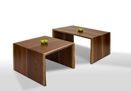 Fun basement family room features a white linen sectional with a reclaimed wood waterfall coffee table over a tan jute rug and a ping pong table. Waterfall Coffee Table David Stine Furniture David Stine Furniture