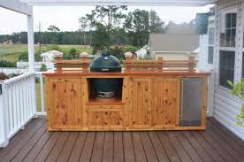 Astounding Outdoor Kitchen On Wood Deck With Natural Finish Wooden Outdoor Kitchen Cabinet A Outdoor Kitchen Plans Outdoor Kitchen Cabinets Diy Outdoor Kitchen