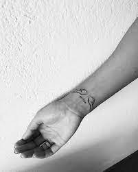 On The Hand Wings Of Angels Tattoos Neck Tattoo Angel Wings Tattoo Wing Tattoos On Wrist