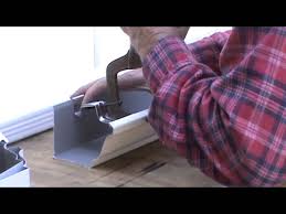 Hire an electrician to run electricity though your ceiling if there then press the hanger up into the ceiling until you reach the tape. Tips For Installing Amerimax Home Products 5 In Hidden Hanger With Screw 5 16 13 Mpg Youtube