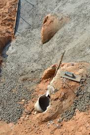 Fill the bottom of the trench with crushed rock (the larger the better) and field stone, if it is available. Broken Drainage Ditch And Concrete Cement Work In Building Construction Site Stock Photo Picture And Royalty Free Image Image 28299139