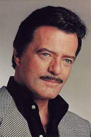 Kudos to robert goulet, matinee idol and broadway musical star (camelot) in his day, winner of a tony, emmy, and grammy, for agreeing to look ridiculous in a small role in this fun. Robert Goulet Beetlejuice Wiki Fandom