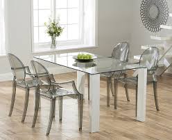 The ghost chair is the reinvention of the classic louis xv armchair in the modern material of polycarbonate.philippe stark is a master at taking a classic form and reinventing it as a modern icon. Ghost Chair Glass Table Contemporary Oak Dining Table Oak Furniture Superstore Dining Decor