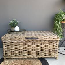 If the trunks are too low for comfortable use, stacking two of them might work. Rattan Trunk With Leather Straps Greywash Large Humble Home