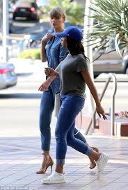 You must see everything taylor swift is wearing on tour. Taylor Swift Goes Back To Her Preppy Style Roots In Denim Jumpsuit In La Daily Mail Online