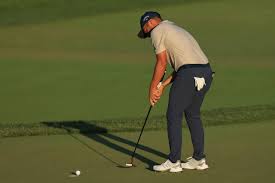 Xander schauffele bites his club on the 16th. British Open 2021 Looks Like Xander Schauffele S Arm Lock Putting Experiment Is Over Before It Really Started Golf News And Tour Information Golf Digest