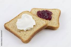 Foto de Torrada integral com geleia e requeijão do Stock | Adobe Stock