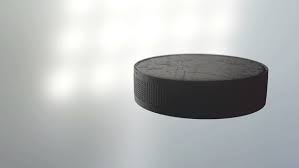 The mass of a the dimensions of a standard ice hockey puck are one inch thick and three inches in diameter. An Ice Hockey Puck Spinning Stock Footage Video 100 Royalty Free 32816113 Shutterstock