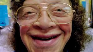 Corinne Wilkinson calls the dance “Un! Deux! Trois! Poussez!” at the John  C. Campbell Folk School