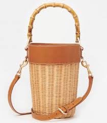 The round woven basket bag was heavy trending last summer and it rattan nation's black rattan bag is made for city gals that love a touch of boho to an otherwise understated look. Habitually Chic The 23 Best Wicker And Basket Bags For Summer