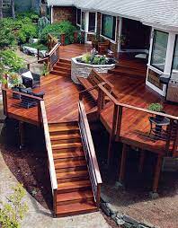 Multi Level Deck With A Stone Planter As The Focal Point Deck Designs Backyard Patio Design Building A Deck