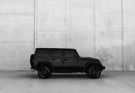 Looking for the best wallpapers? Hd Wallpaper Black Jeep Wrangler Suv Near Gray Wall Black And White Minimal Wallpaper Flare