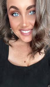 Please meet me ____ the bake shop. (at, with, in)