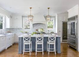 white kitchen with stacked cabinets and