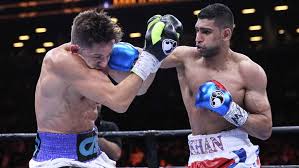 Amir Khan turns back strong challenge from Chris Algieri
