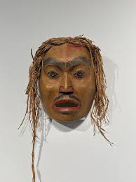 Chief-of-All-Women pole, the Tlingit totem pole, in Pioneer Square... 1st  Ave. It is one of the few totem poles dedicated to a woman. Please pardon  the smudges...Snapped this en route north... through