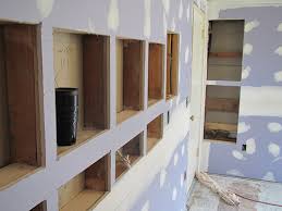 All wires remain hidden behind the wall for organized and secure connections. Built In Shelves For My Home Office Design