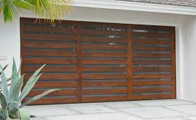A Summary Of The Types Of Materials Used To Make Garage Doors Contemporary Garage Doors Garage Doors Modern Garage Doors