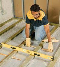 Installing Sub Floor Sleepers Over Slab Insert Shims To Level Floor If Needed Flooring Garage Remodel Diy Basement