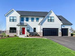 A modern white farmhouse exterior makeover. Modern Farmhouse Exterior James Hardie